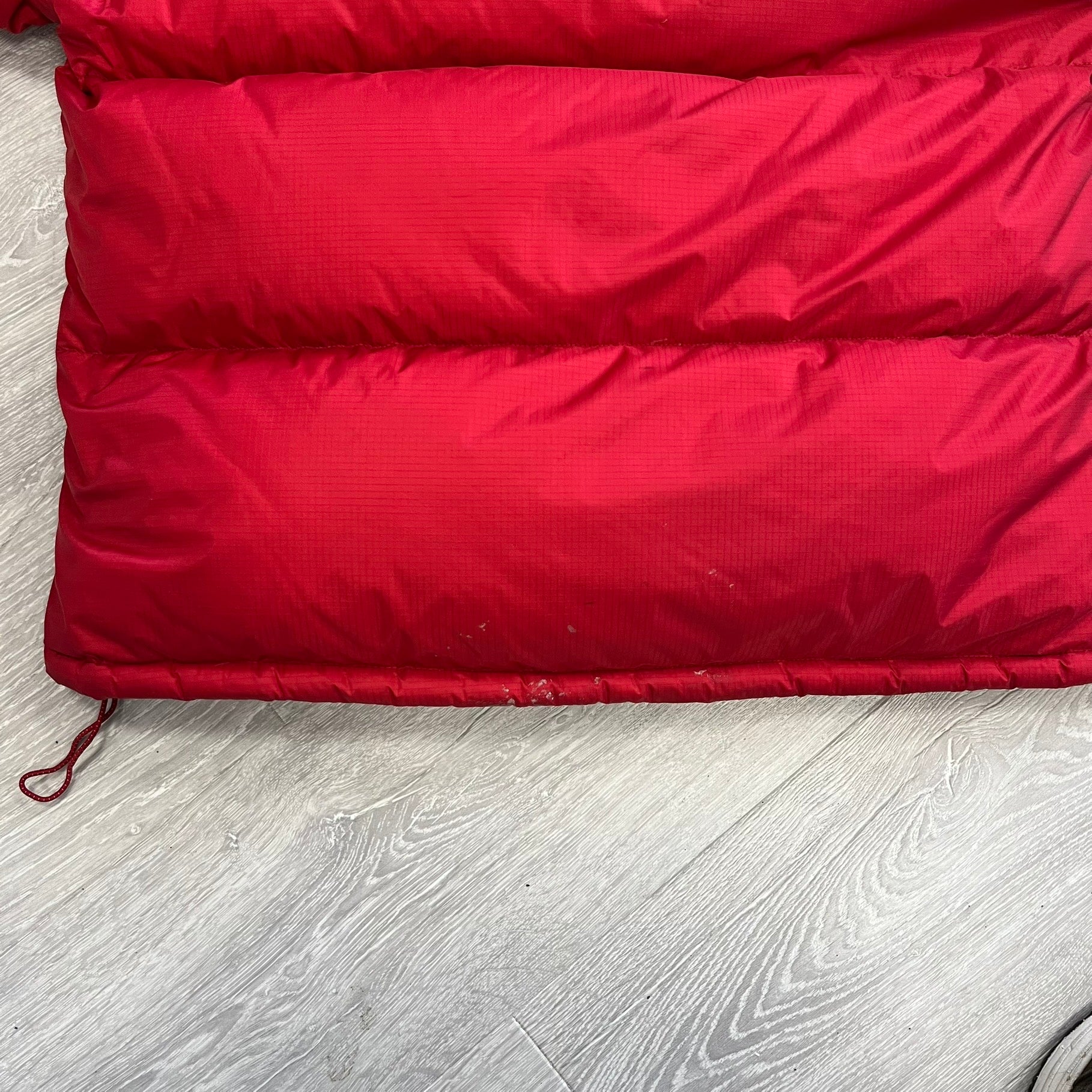 The North Face Red Baltoro Puffer Jacket WITH STAINS