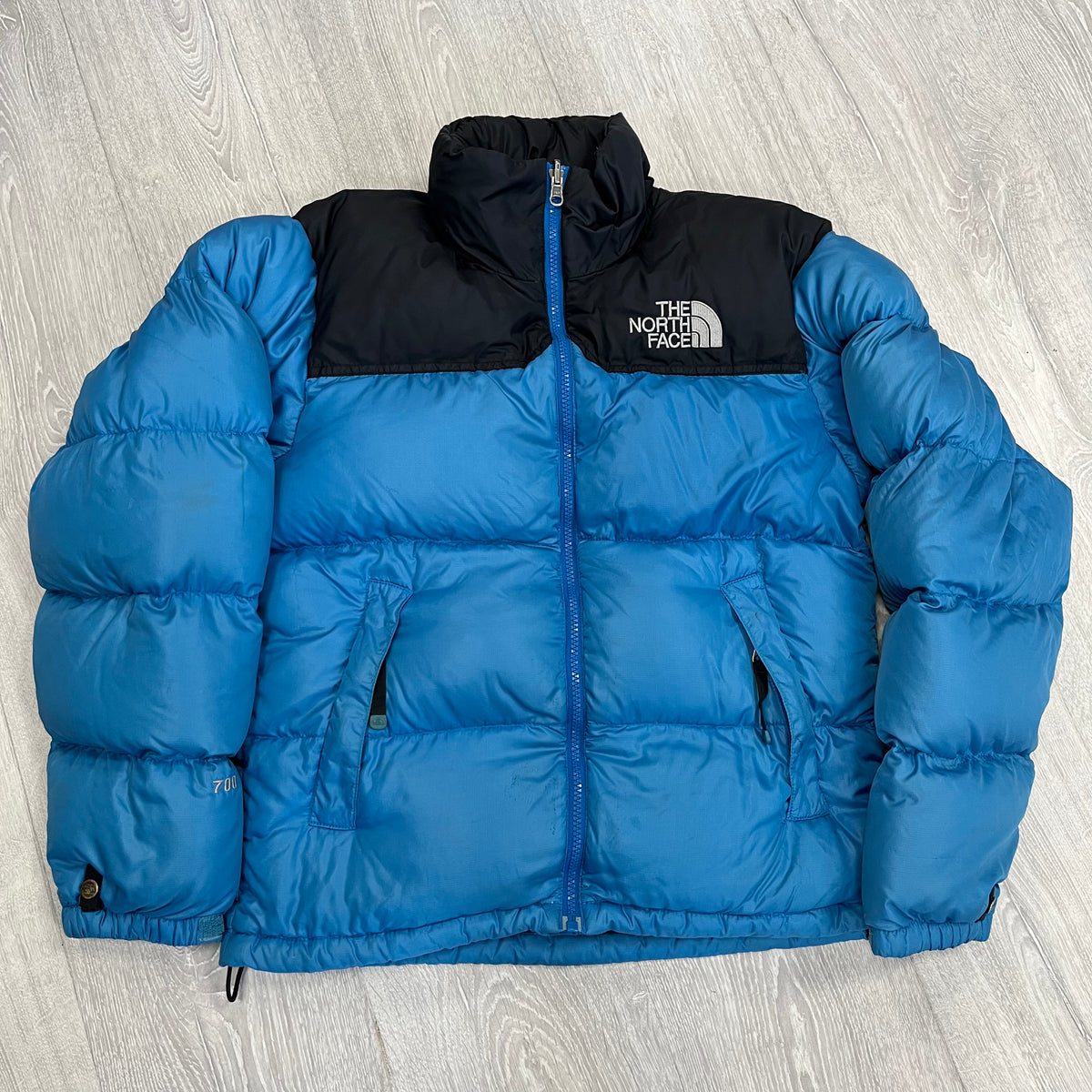 Baby blue north face best sale puffer jacket