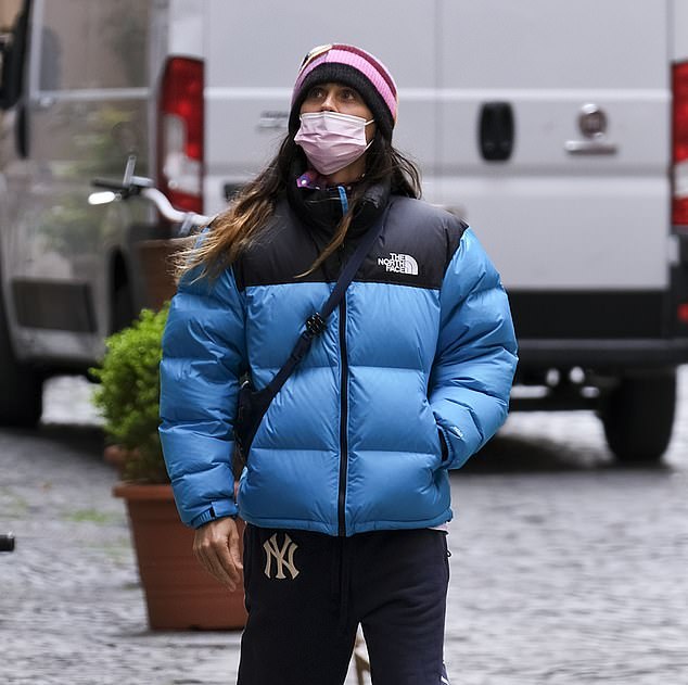 The North Face Baby Blue Puffer Jacket WITH SLIGHT FADED COLOURING